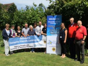 Lions Club members wih Wimborne Dementia Friends representatives at the presentation of their banners